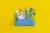 عکس رایگان JPG باکیفیتاز  جامدادی مدرسه شامل لوازم تحریر شامل قیچی و ماشین حساب و پرگار و پاکن و مداد و گیره با تم آبی با پس زمینه زرد 22134