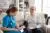 پزشک زن در حال اندازه گیری فشار خون پیرمرد در خانه سالمندان با استفاده از دستگاه دیجیتال 24328