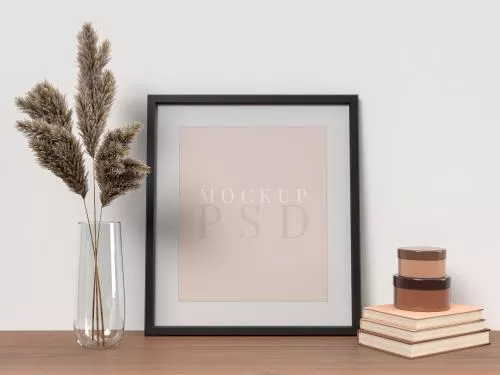 موکاپ فتوشاپ قاب عکس به همراه گل و گلدان و کتاب فایل PSD لایه باز 21547